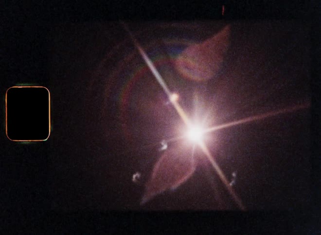 Dynamic hand-held Super 8 film footage following a fireworks rocket launching into a night sky and explode as symbol for a festive celebration and the western culture on New Year’s Evening