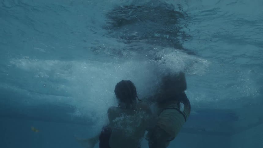 Two children playing in the pool