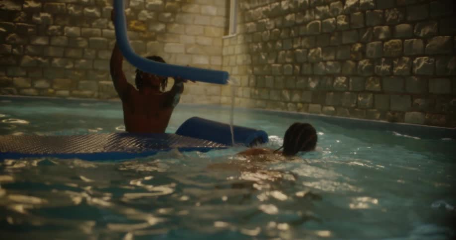 Friends play around in the pool