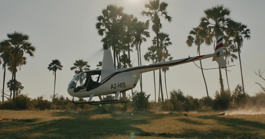 Helicopter in a natural area starting the engines and flying