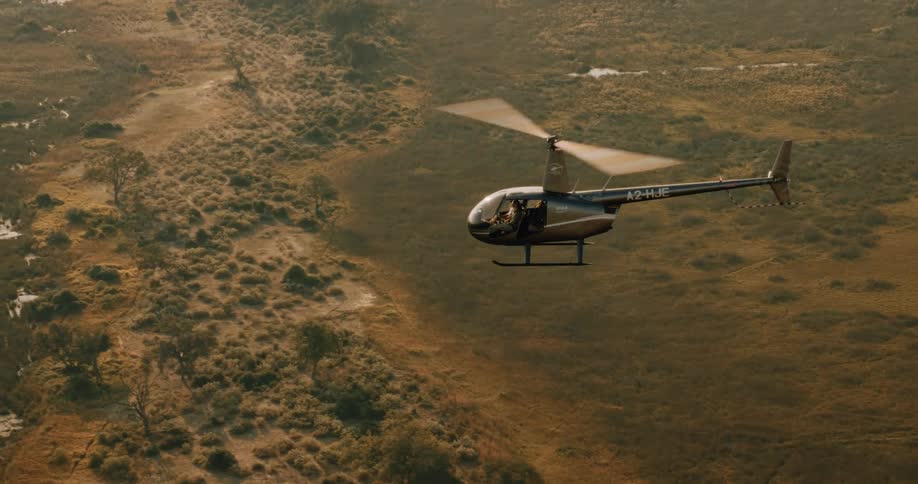 Aerial view of a helicopter flying over the swamps of the Okavango Delta