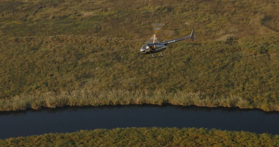Aerial panorama of a helicopter flying over a swamp on the Okavango Delta