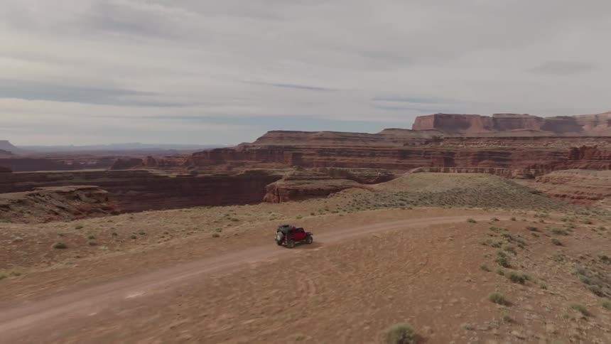 A vehicle drives off road in the canyon