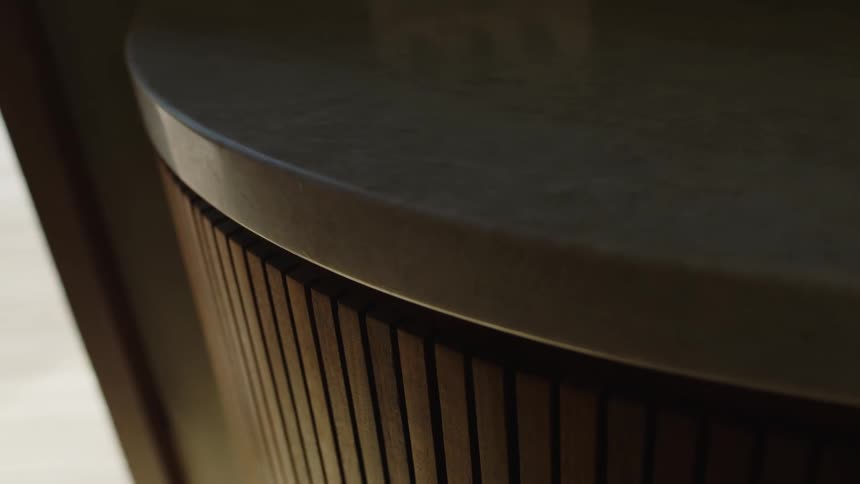 Closeup of the side of a piece of furniture with marble stone and wood finishes