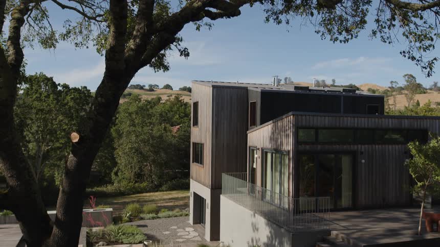 Large modern house in a natural environment surrounded by trees