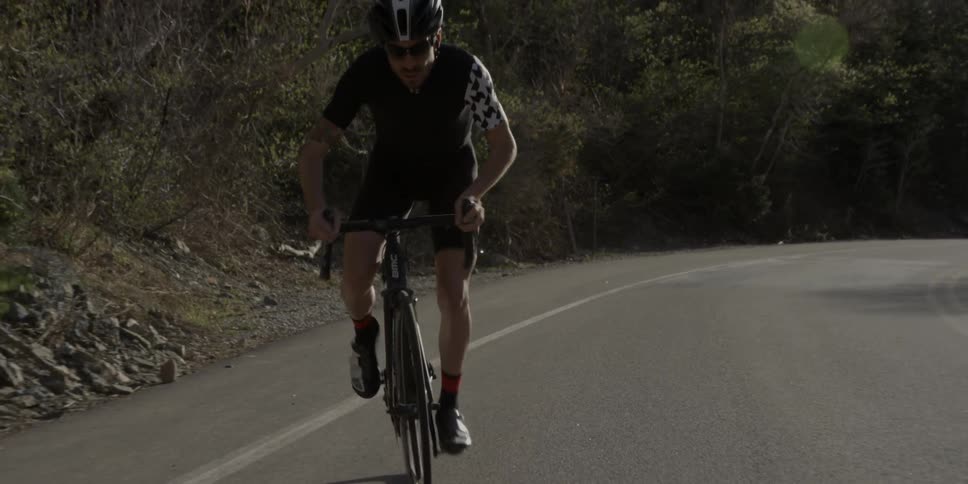 A man rides a bicycle on a street