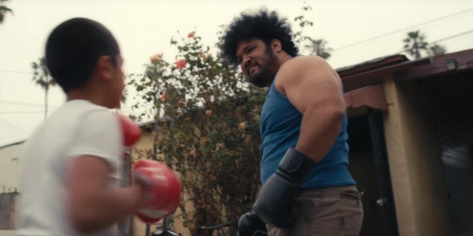 Child and adult boxing aggressively