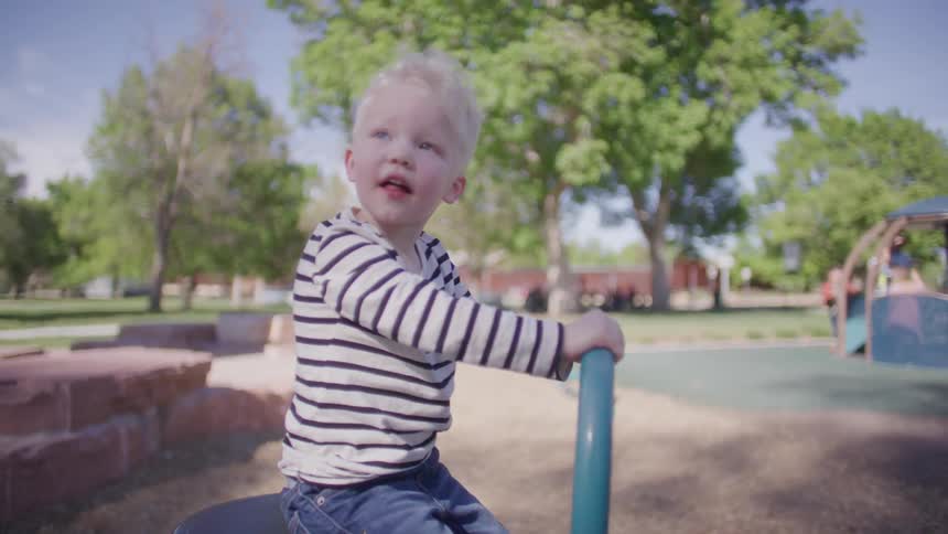 Boy playing on a trampoline in a park