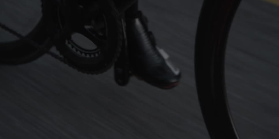 A person pedals a bicycle