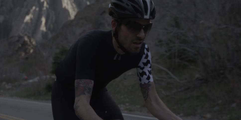 A man pedals a bicycle
