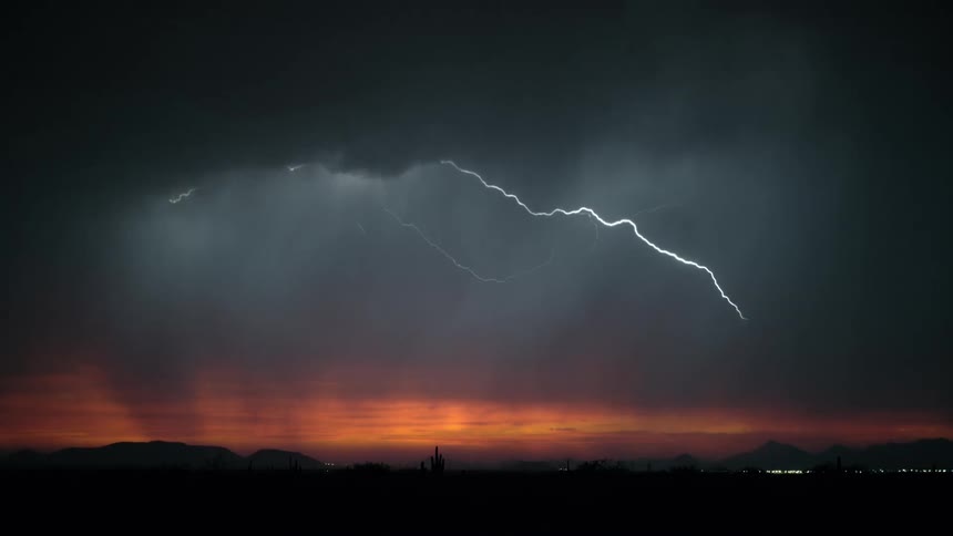 Storm with lightning in a dark red sky