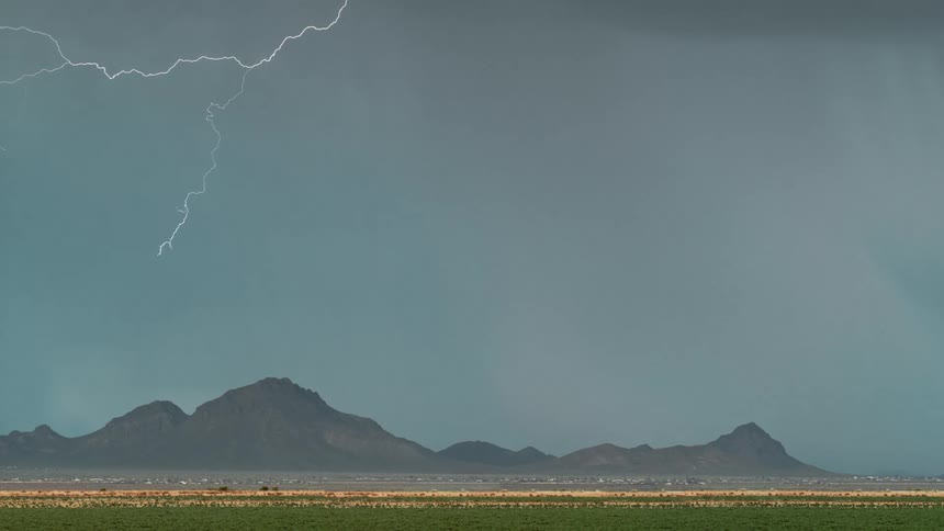 Natural landscape with mountains and lightning in a storm