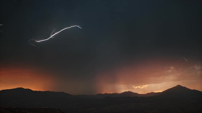 A time lapse shows numerous bolts of lightning streak across the sky during a storm