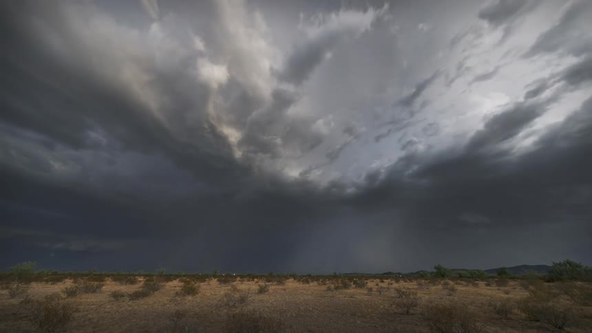 Landscape in a dry field with thunder and storm
