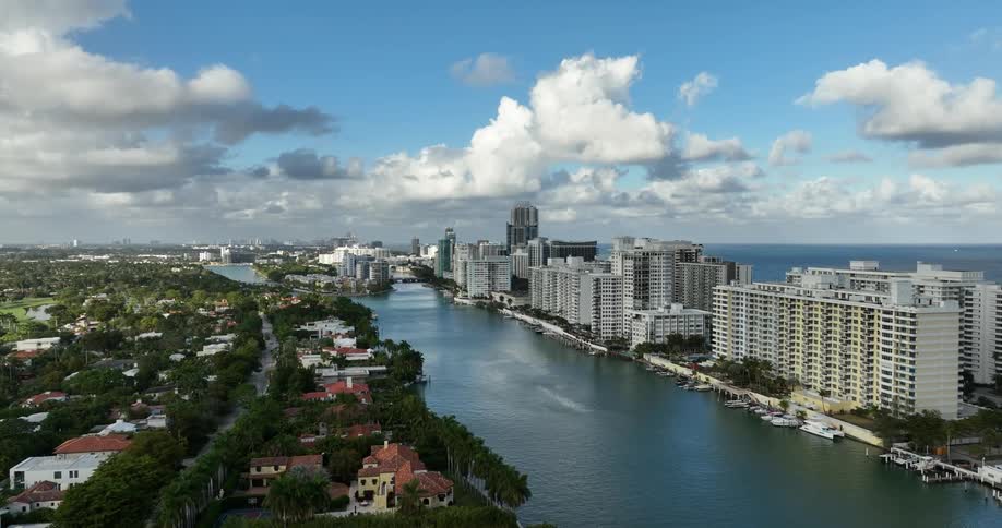 Aerial panorama of an urban city by the sea on a partly cloudy day