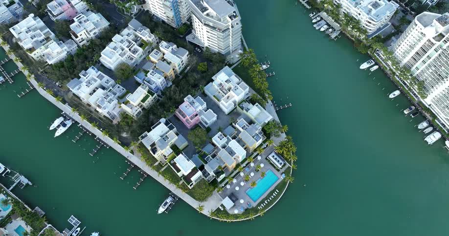 Aerial panorama of a metropolis with large buildings and turquoise seaside
