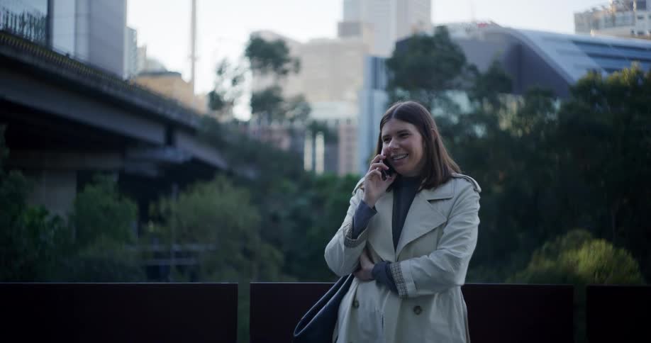 Woman on a call with her smartphone while in an urban environment