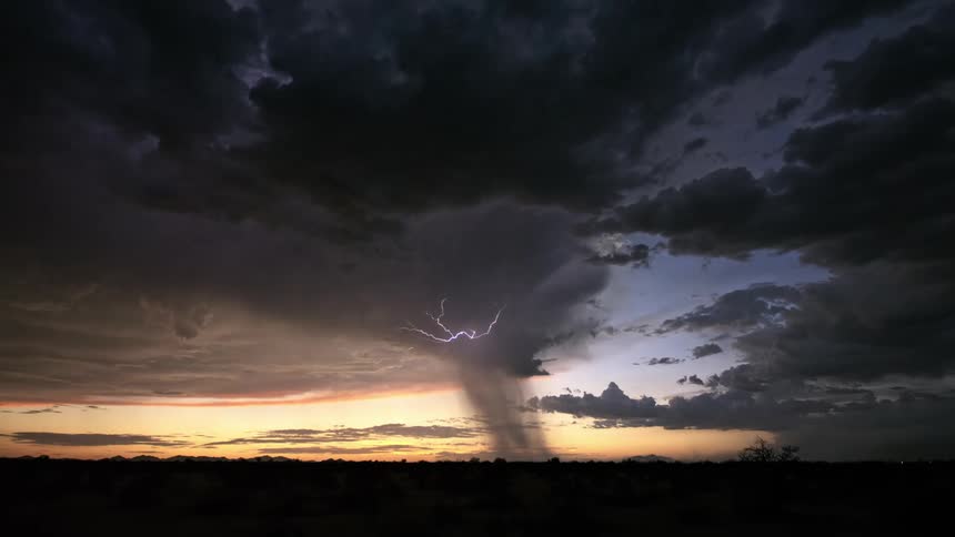 Natural landscape with dark red sky and bursts of thunder