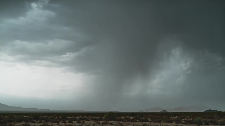 A dramatic thunderstorm with lightning strikes the plains in daylight