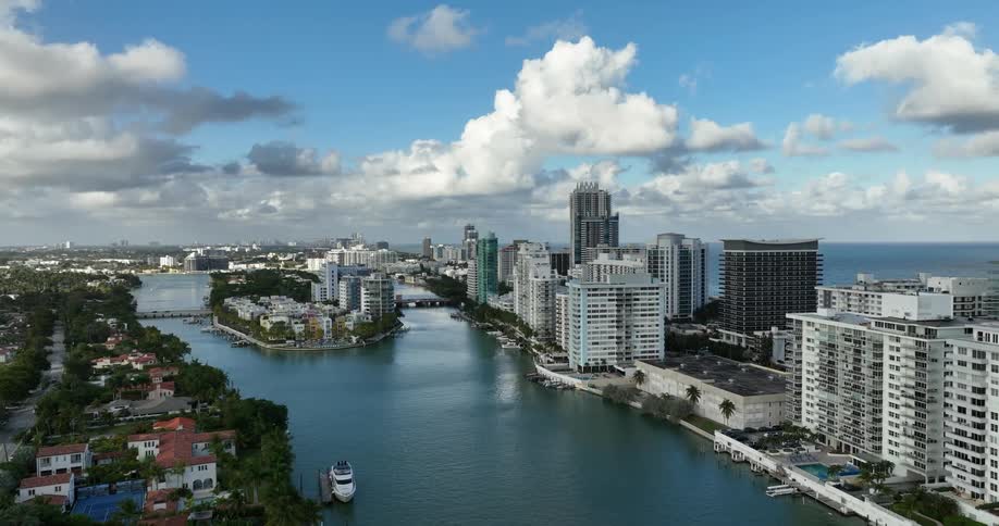Aerial scene of urban and commercial buildings surrounded by the sea