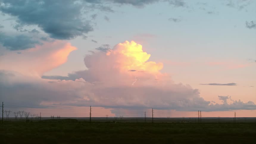 A dramatic sky illuminated by the sun with a striking lightning bolt
