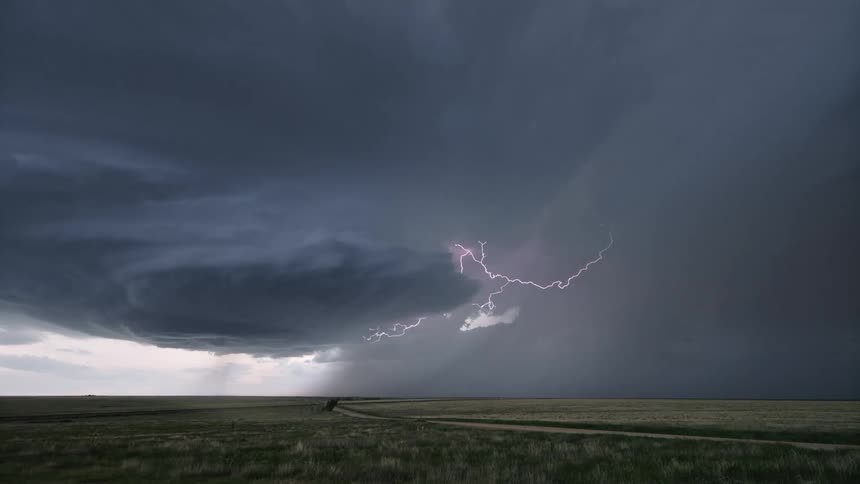 Heavy rain pours on the long field