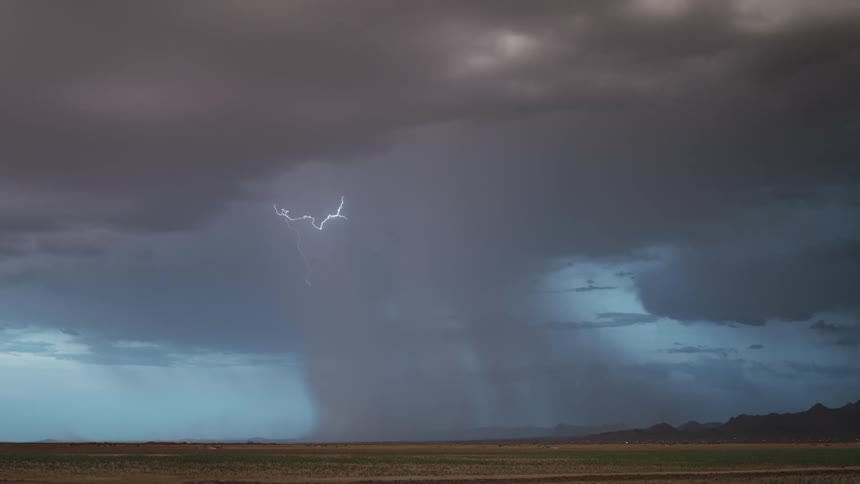 Field a dark sky with storm and thunder