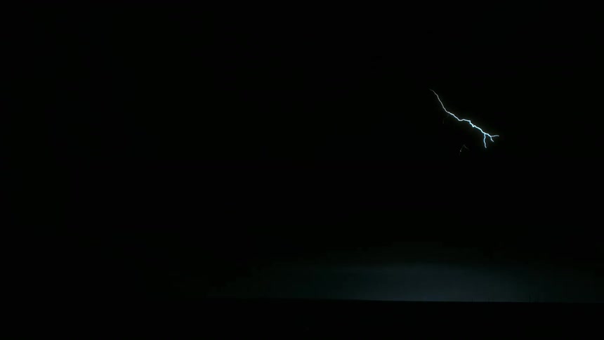 Lightning strikes illuminate the night during a storm