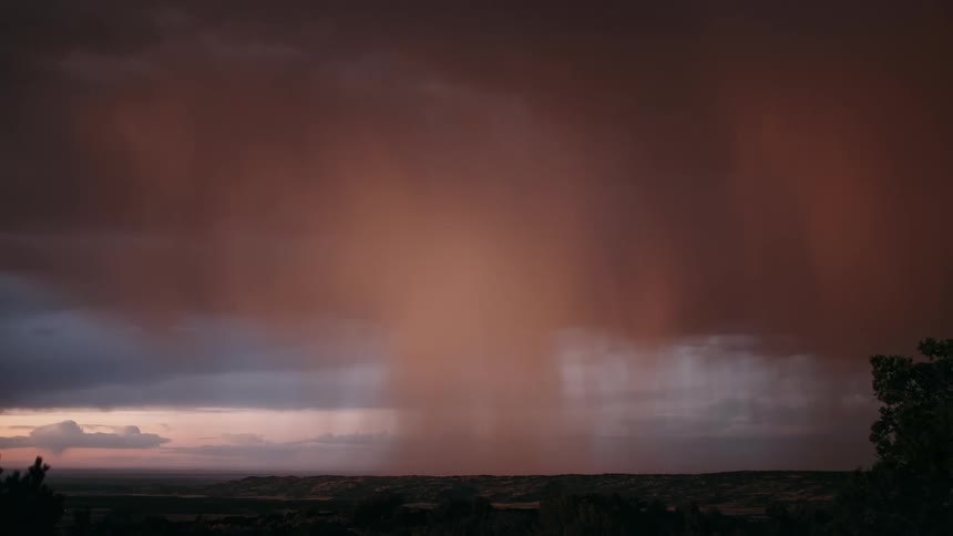 Storm with rain and lightning in a reddish sky