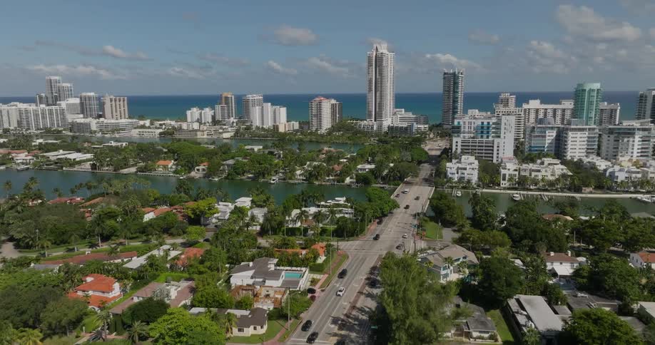 Aerial panorama of an urban city with modern buildings by the sea