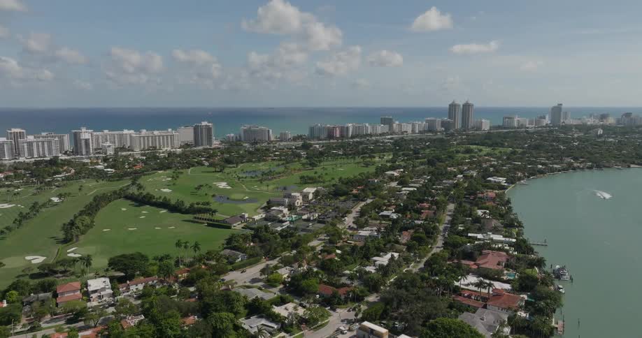 An aerial view of a vibrant coastal city in florida the coast stretches toward the horizon