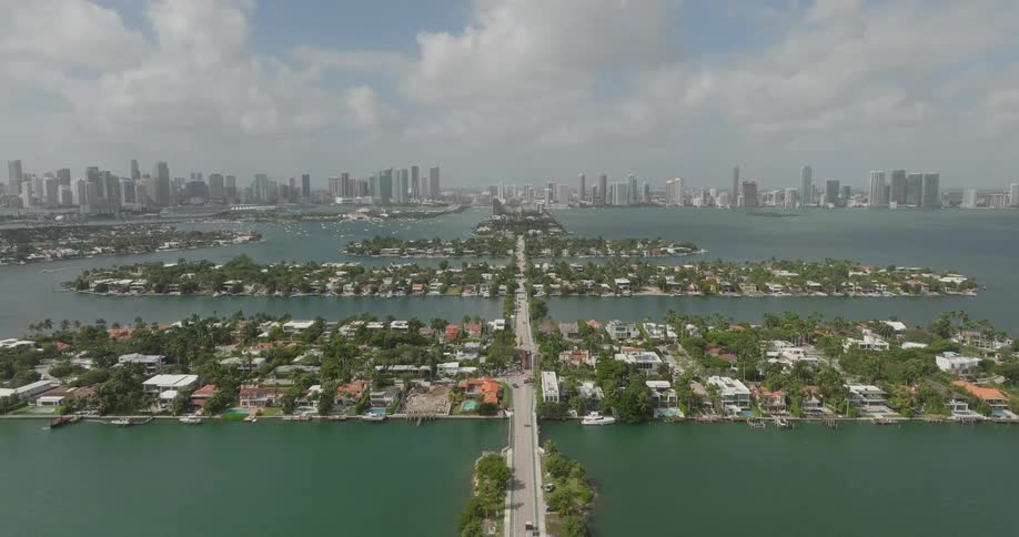 Long highway connects residential neighborhoods occupying small islands to downtown on the mainland