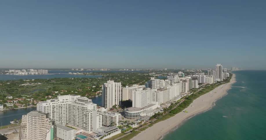 Aerial panorama of a city on the edge of a turquoise beach