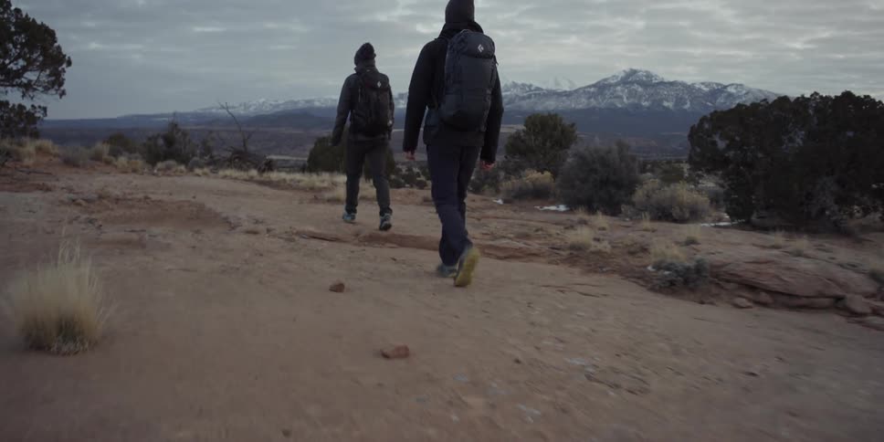 Couple hiking through a barren wilderness