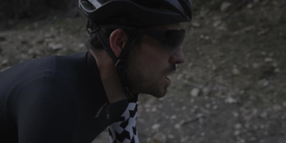 Man riding a bicycle up a hill