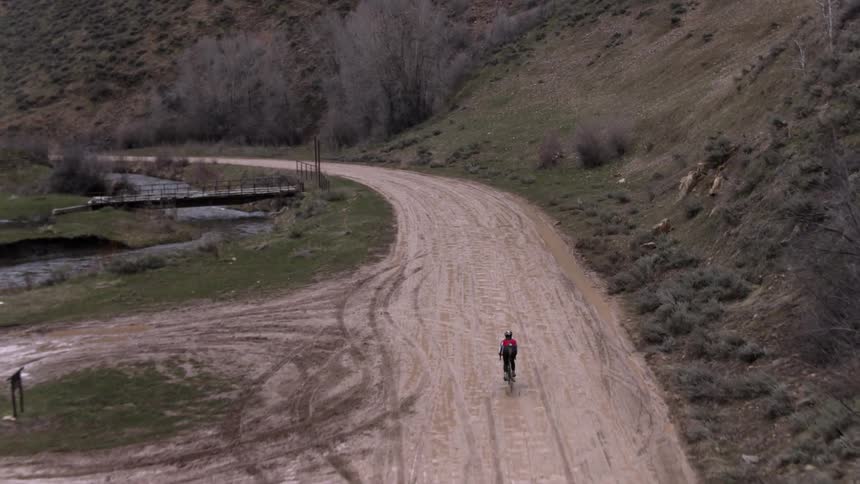 A person is riding a bicycle down below