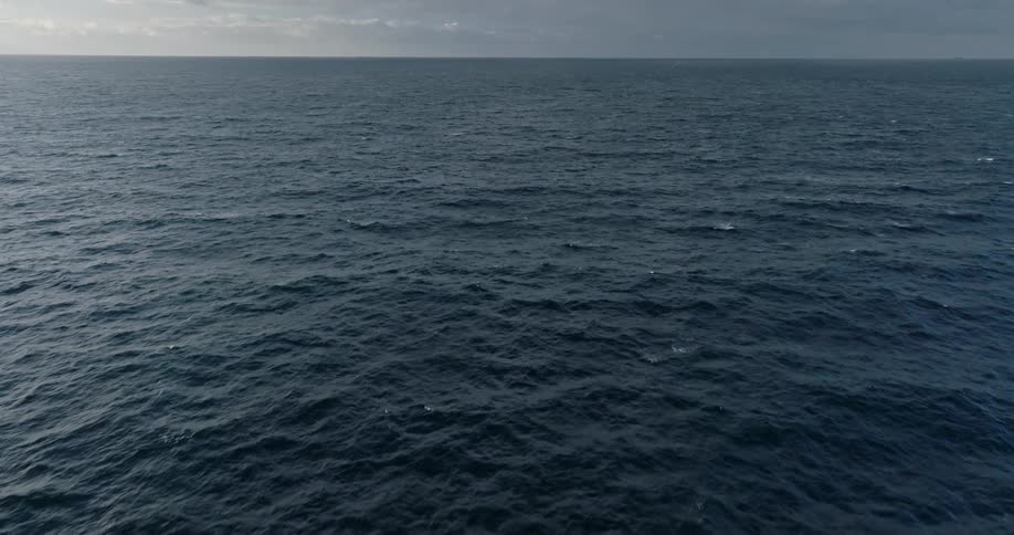 Aerial view of an extensive ocean with calm waves