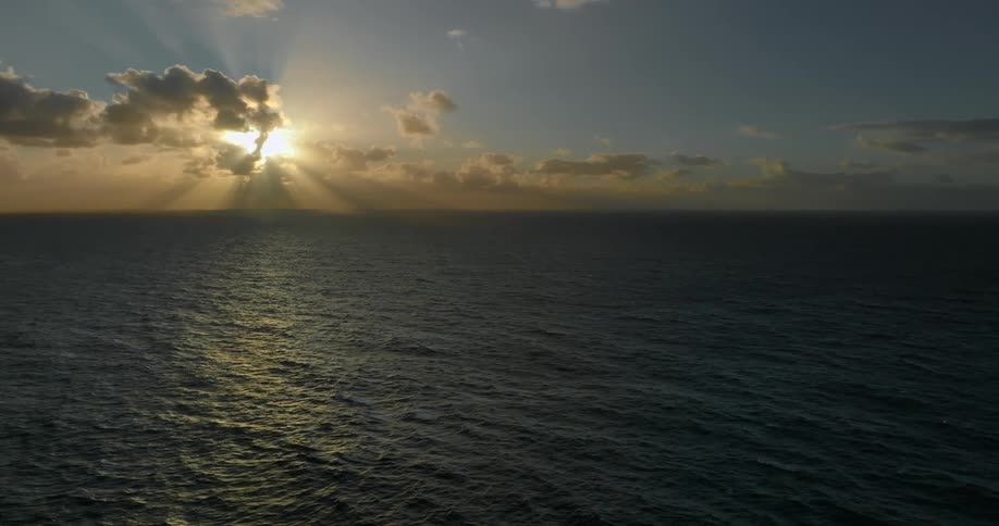 A huge ocean with the surface reflecting sunlight