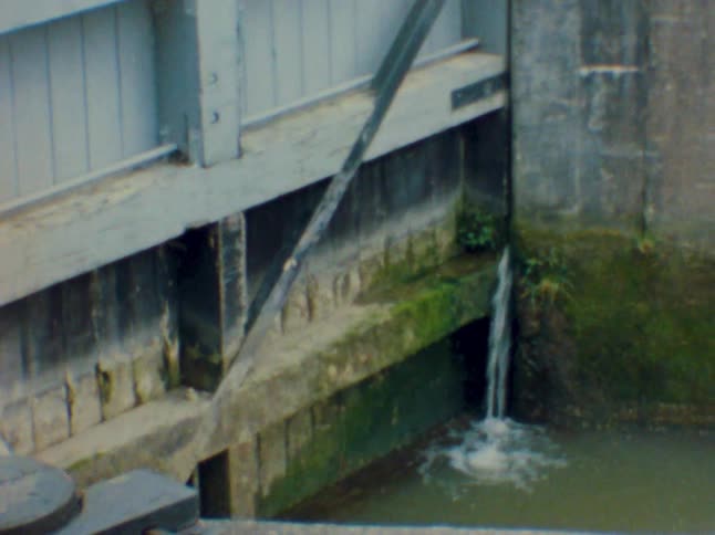 Water falling from a wall straight into the sewer