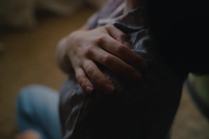 Person with hand on shoulder