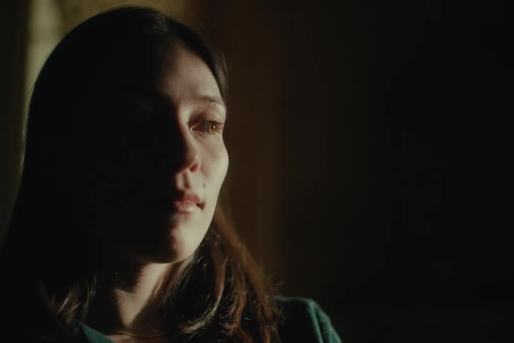 Portrait of a woman with sunlight reflecting on her face