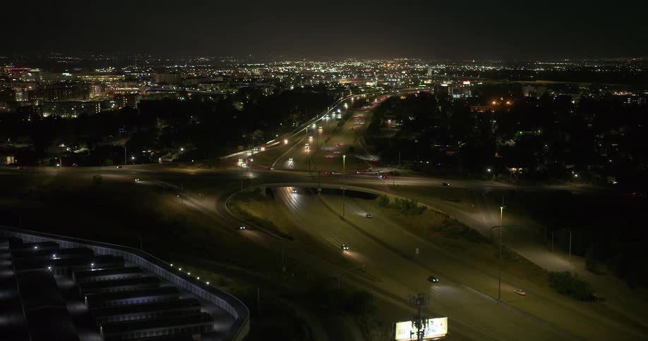 Night view of a city with a highway with several moving cars