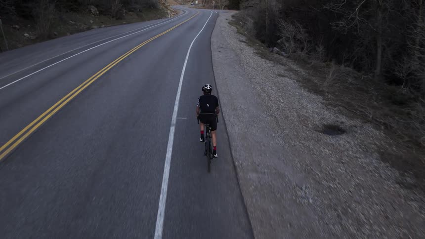 Man riding a bicycle on a highway