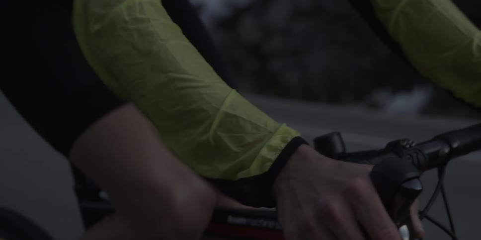 A person is riding their mountain bike on a windy day
