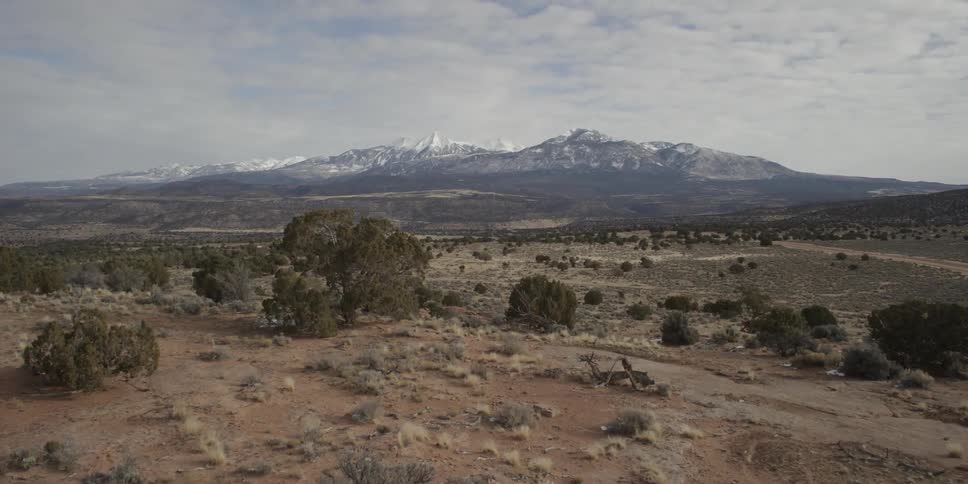 Looking over the vast desert towards the snow capped mountains in the distance