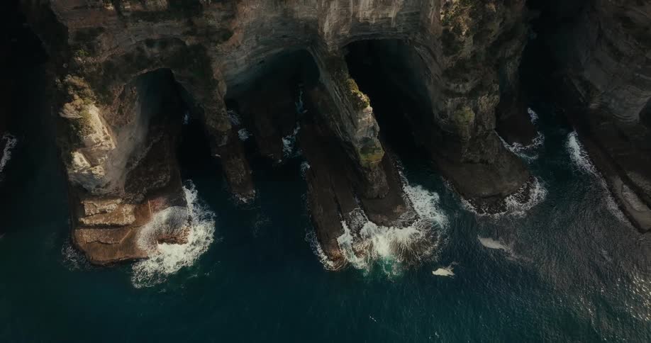 Aerial view of rocky coast and crashing waves