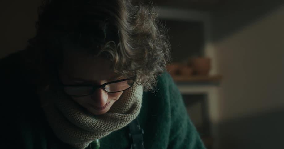 Portrait of a woman looking down in concentration