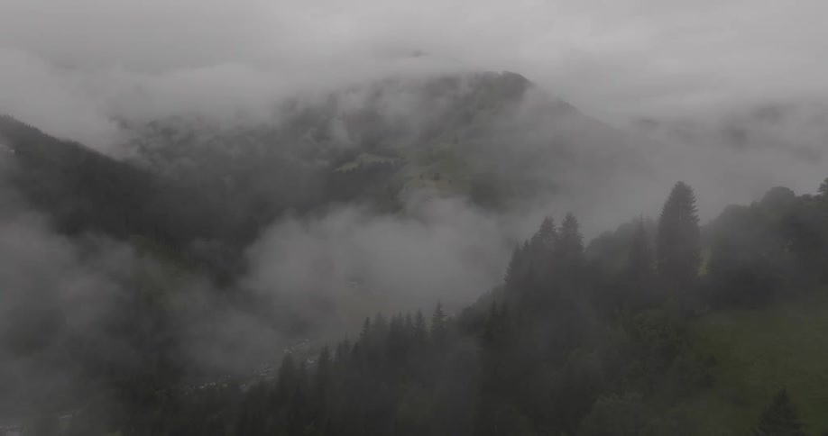 Aerial landscape of low fog shrouding mountains