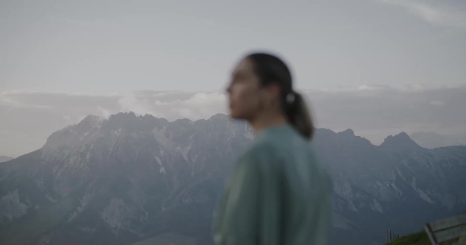 Woman walking in a natural environment through the mountains