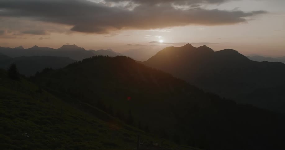Mountain range with sunrise on the horizon
